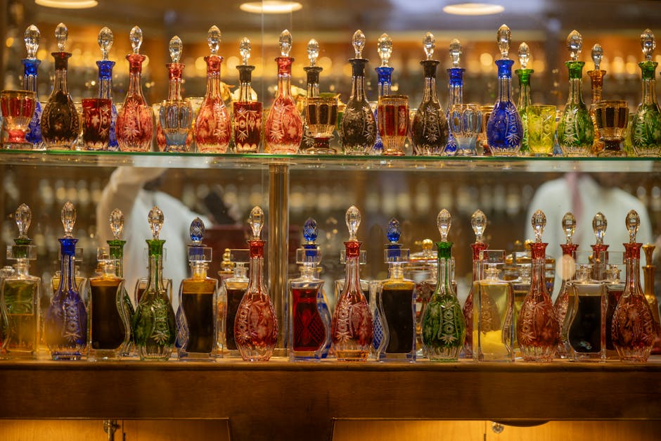 Luxury designer fragrance bottles displayed on a marble surface, showcasing premium summer perfume options