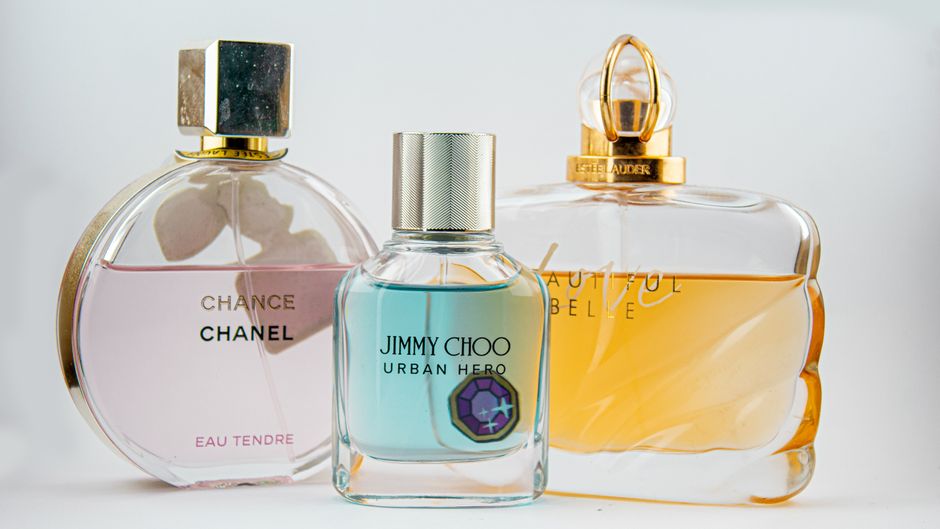 Collection of summer perfume bottles arranged in warm sunlight, ideal for hot weather fragrance shopping
