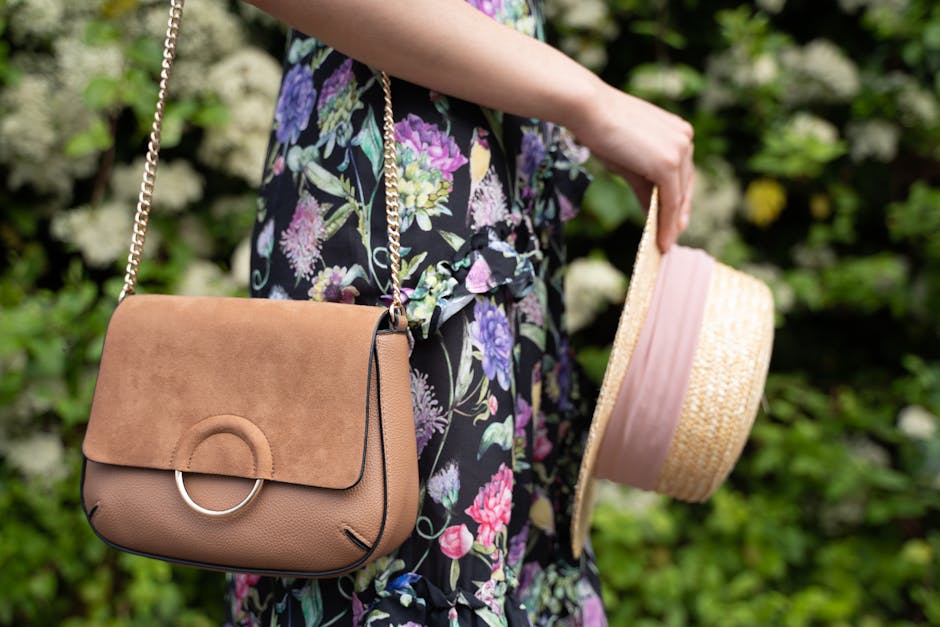Woman in a bold floral wrap dress styled with sandals for a summer occasion