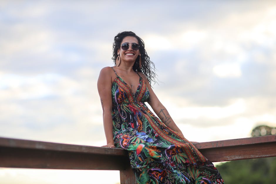 Model wearing a vibrant Desigual bold print summer dress in bright colours