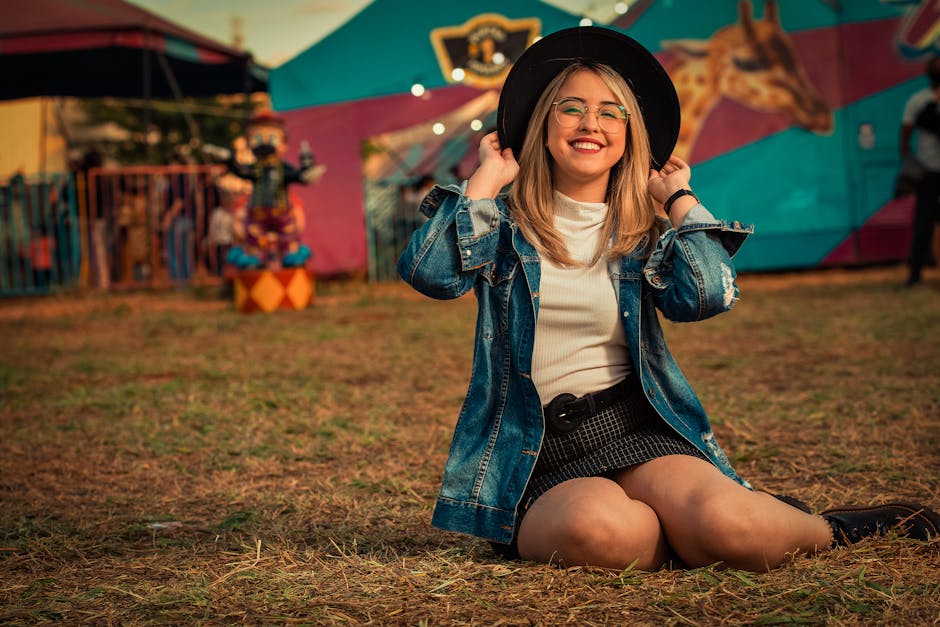 Stylish festival outfit featuring Hunter wellington boots, denim shorts, and a tote bag