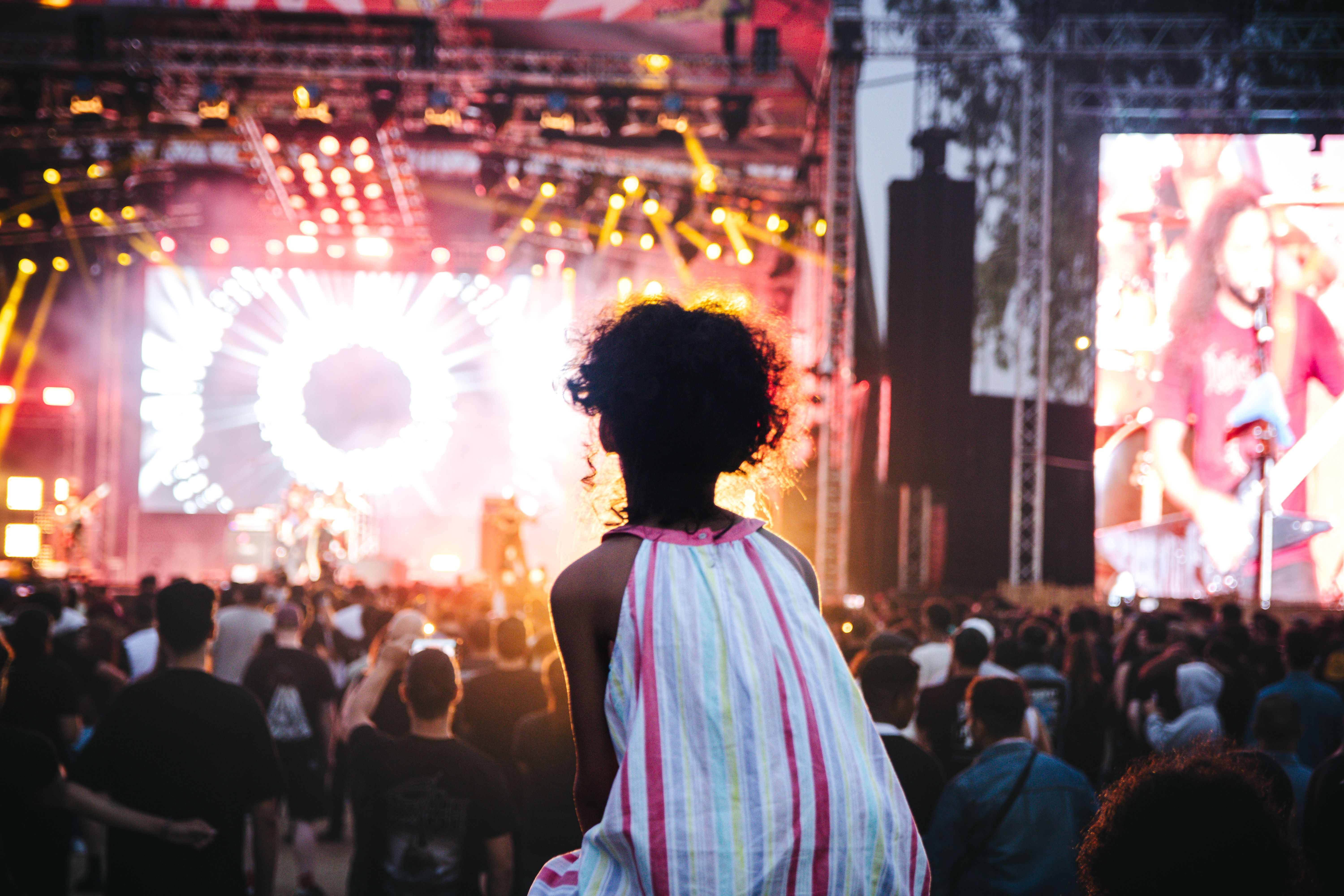 Vibrant outdoor music festival in Casablanca, Morocco with a lively crowd and colorful stage lights.