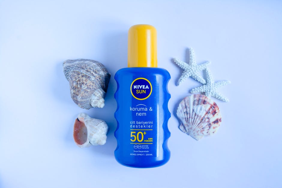 Elemis skincare products arranged on a marble surface with soft summer light