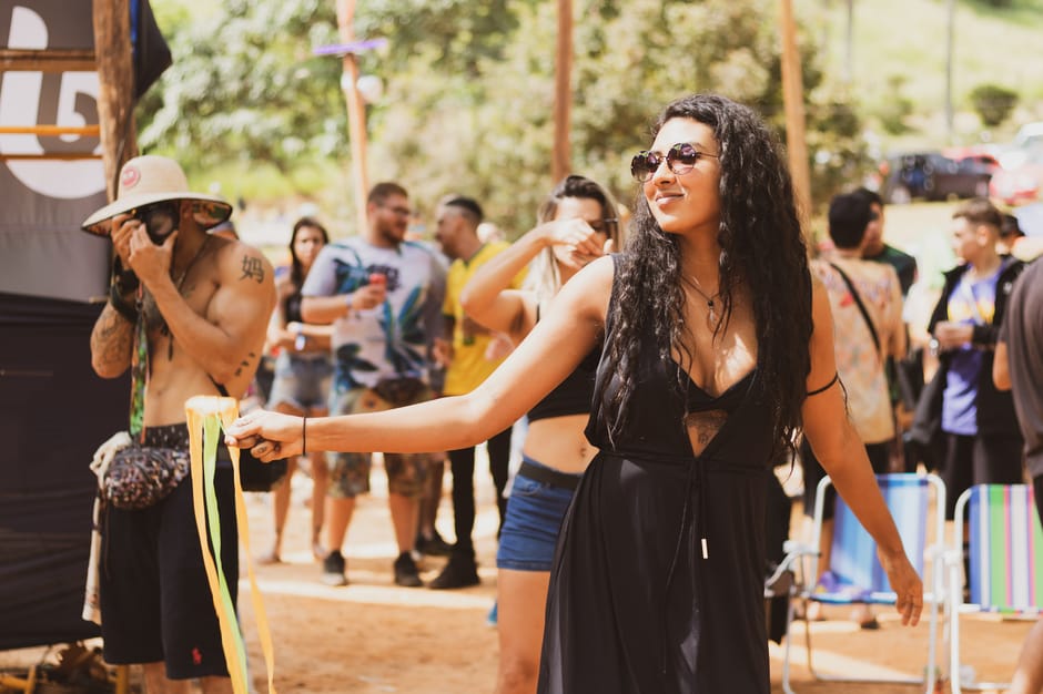 Woman wearing a bohemian-style festival outfit with crochet top and floaty skirt