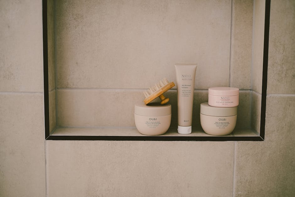Woman applying a deep conditioning hair mask in the shower during a post-beach haircare routine