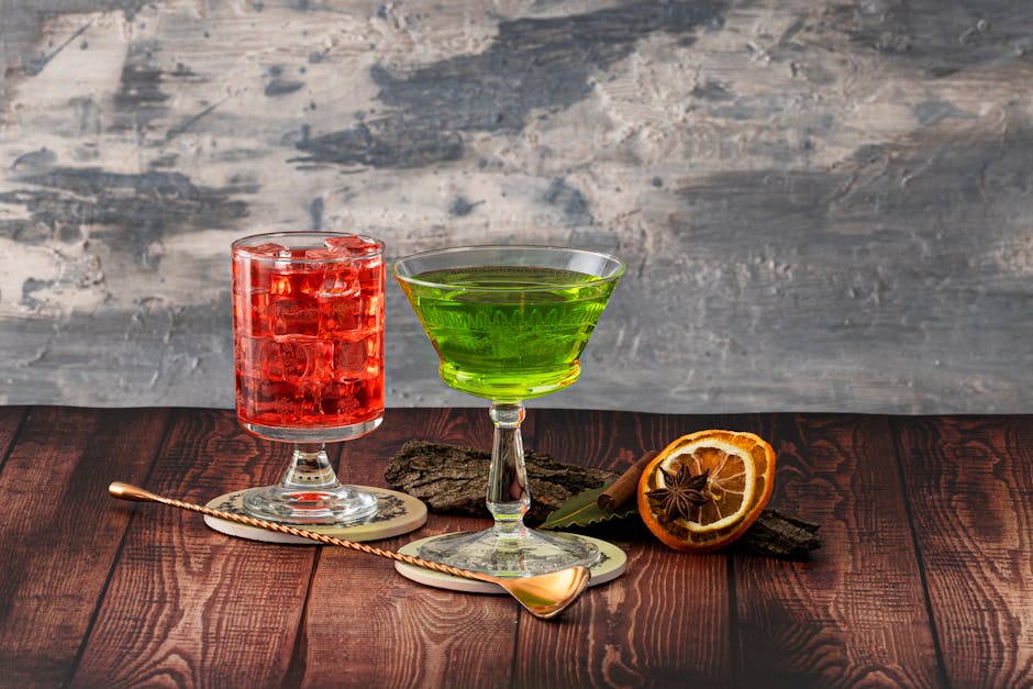 Set of designer cocktail glasses and barware on a garden table