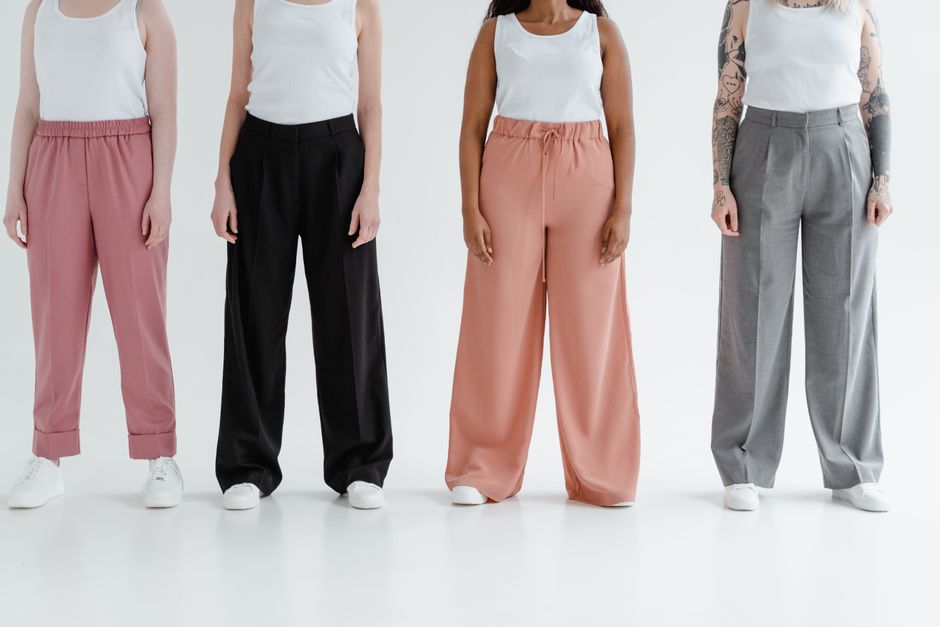 Model wearing wide-leg linen trousers and a simple top styled for summer