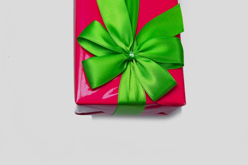 Elegantly wrapped luxury gift box with ribbon on a marble surface