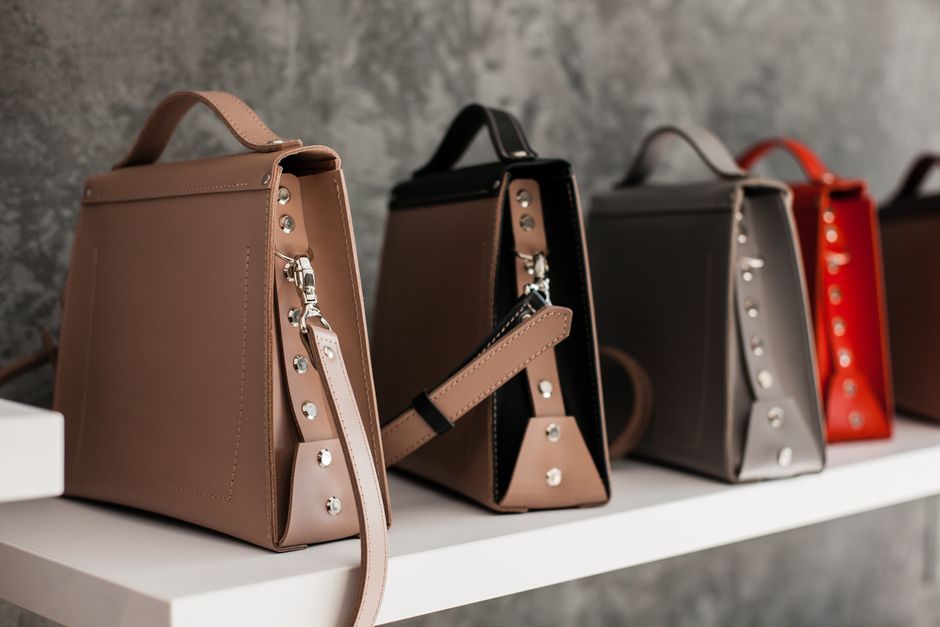 A structured leather designer shoulder bag on a neutral background