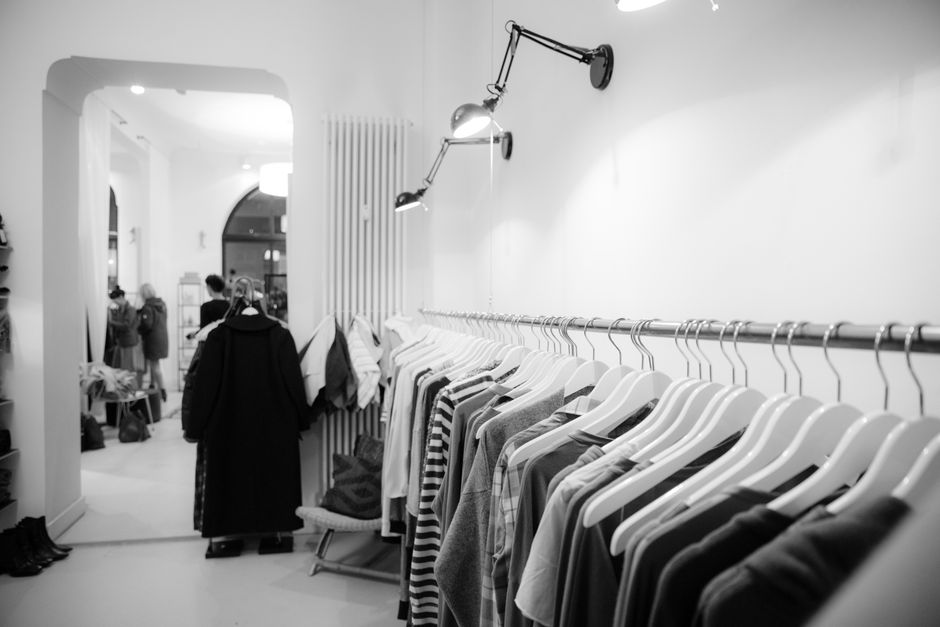 A rail of designer clothing available at a discount, reflecting the Secret Sales shopping experience