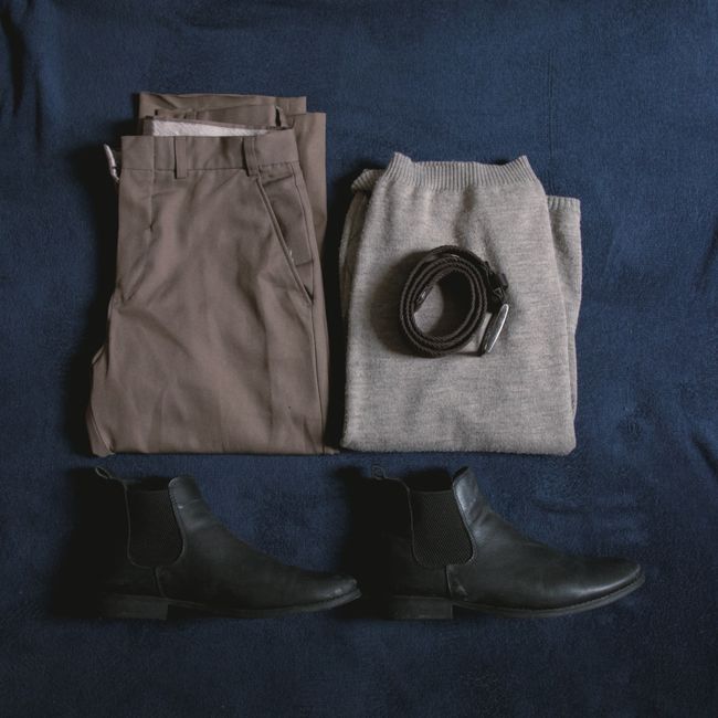 A flat lay of carefully chosen clothing and accessories representing a personal wardrobe edit