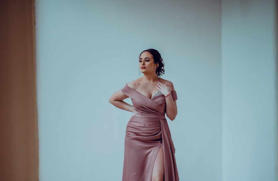Floaty dusty mauve midi dress laid flat on a sun-drenched terrace, styled with tan leather sandals