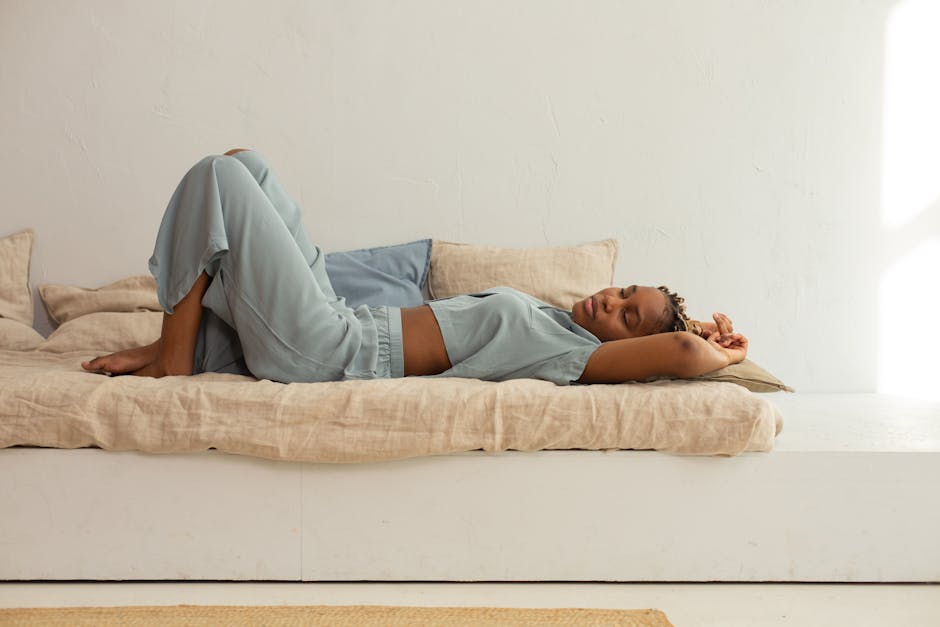 A model wearing a matching sage green linen shirt and wide-leg trouser co-ord set