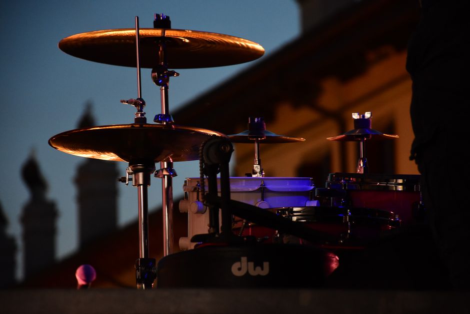 A steel pan band performing live at an outdoor street festival