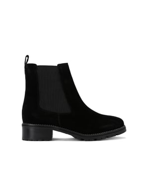 This Kurt Geiger Crystal Welt ankle boot features a black suede upper. There are two elasticated panels at the ankle for slip-on comfort and a silver pin stud at the back of the ankle. The sole is surrounded by silver crystals.