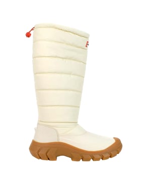The Hunter Intrepid Tall Women's White Snow Boots are designed for superior performance in extreme winter conditions, combining style, durability, and warmth. These boots are built to handle deep snow and icy terrains, offering optimal protection and comfort while maintaining a sleek, modern look.
 
Key Features:
Fully Waterproof: 

Constructed with waterproof materials to keep feet dry in wet and snowy conditions, perfect for outdoor winter adventures.


Tall Design: 

The high boot silhouette provides added protection from deep snow and cold winds, ensuring your legs and feet stay warm and dry.


Thermal Insulation: 

Lined with premium insulation to trap heat, keeping your feet warm even in freezing temperatures, making them ideal for harsh winter weather.


Durable Rubber Sole: 

Features a rugged rubber sole with high-traction treads, providing excellent grip on slippery, icy surfaces for enhanced stability and safety.


Adjustable Fit: 

Equipped with an adjustable drawstring or strap at the top for a customizable fit, allowing for comfort and better protection against the elements.


Stylish White Color: 

The clean white design adds a chic, modern look to your winter wardrobe, while still offering practicality and function.


Hunter Branding: 

Subtle yet iconic Hunter logo detailing on the front adds authenticity and style to the overall design.


 
The Hunter Intrepid Tall Women's White Snow Boots are the perfect combination of fashion-forward style and rugged functionality, designed to keep you warm, dry, and comfortable in even the harshest winter environments. Whether you're trekking through snow-covered landscapes or enjoying winter activities, these boots provide the protection and style you need.