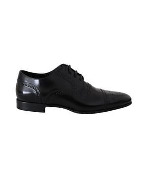 Marca: Dolce & Gabbana.
  Color: Negro.
  Material: 100% cuero.
  Suela de cuero y forro interior.
  Detalles del logotipo.
  Fabricado en Italia.