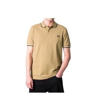 The Twin Tipped Fred Perry Polo Shirt by Fred Perry is a short sleeved polo shirt that has been made from Fred Perry's classic cotton piqué, in a contemporary adaptation of Fred's famous streamlined fit. Available in a diverse range of colourways - each with their own unique story. Featuring the signature Fred Perry wreath logo to the chest and twin tipping to the collar and cuffs.
