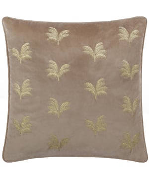 Transform your living space with the Guilded Palms Embroidered Cushion, the perfect blend of elegance and comfort. This opulent cushion boasts a luxuriously soft velvet base adorned with intricate metallic embroidery depicting serene palm leaves. The rich texture of the velvet combines with the shimmering embroidery to create a striking balance of modern sophistication and timeless charm. Designed for those who value understated luxury and meticulous attention to detail, this cushion will effortlessly elevate any space into a haven of style and relaxation. Add an unmistakably refined finish to a sofa, armchair or bed, and indulge in its inviting presence.