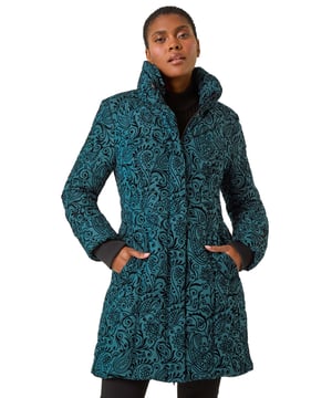 Paisley Hooded Flock Coat from Roman. Paisley perfection awaits in this striking Winter flock coat. Adorned with a new, intricate flock pattern, this coat features a padded funnel neck collar for extra warmth. Complete with a front storm flap and centre front coil zip with silver metal zip pullers, this piece is as stylish as it is practical. Ribbed cuffs inside the sleeve cuff add a modern touch, while front welt pockets provide functionality. Layer over knitwear and jeans for a chic and cosy ensemble!