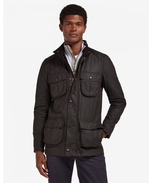 Barbour Corbridge Wax Jacket
The Corbridge is a rugged utility-style men's waxed jacket updated with a contemporary engineered fit. With winter in mind, this multi-functional jacket is constructed in Barbour's hardy 6oz Sylkoil waxed cotton with a comfortable, lightweight Nylon lining quilted to 50g wadding, for additional warmth. The corduroy-lined funnel collar features an integral Nylon hood complete with adjustable toggles for a perfect fit, offering wet-weather defence when needed but easily stowed away in the collar on dry days. Built to offer comfort and protection to those who are active outdoors in any weather, the Corbridge benefits from adjustable cuffs, a robust two-way zip, a storm fly front with stud fastenings and an action back. The classic four-pocket detail adds a stylish, practical feature that keeps essentials safe and hands free. Available in a choice of three versatile colours. As this is a slim fitting jacket, we would advise purchasing the next size up than you would normally choose.

Tailored Fit
Barbour tonal embroidery to left pocket
Outer: 100% cotton (waxed)
Inner: 100% polyamide
6oz waxed cotton
Do not wash
Sponge clean only
Back length: 78.8cm - 83cm

MWX0340