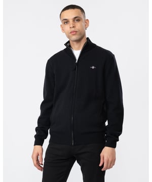 Your classic, wear-with-anything sweater. Crafted from 100% superfine lambswool, this cardigan with a zipped front is perfect for layering. Cut for a regular fit with ribbed detailing at the hem and cuffs.

Regular fit
Zip front
Rib endings at hem and sleeve cuffs
GANT graphic embroidered at chest

Material: Lambswool 100%
87214
 
 