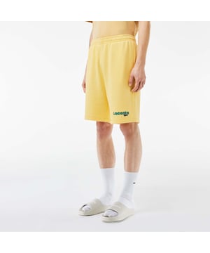 Washed Effect Lacoste Print Jogger Shorts Organic cotton fleece Regular fit  straight cut  Drawstring waist Contrast Lacoste print Embroidered crocodile on front Washed Effect Lacoste Print Jogger Shorts Organic cotton fleece Regular fit  straight cut  Drawstring waist Contrast Lacoste print Embroidered crocodile on front