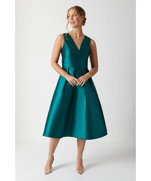 This style is part of the Coast Honoured Collection, a dedicated range of timeless bridesmaid dresses guaranteed to fit and flatter every member of your bridal party. This remarkable dress seamlessly blends classic elegance with a contemporary touch, thanks to its plunging neckline and structured twill midi design. Ideal for any memorable event, this dress radiates sophistication and grace. Made from duchess twill: This elegant twill is characterised by a lustrous matte sheen and a heavy weight that allows design silhouettes to hold firmly, making for a truly sculptural finish. Level of stretch: none. This dress fastens with a rear concealed zip.