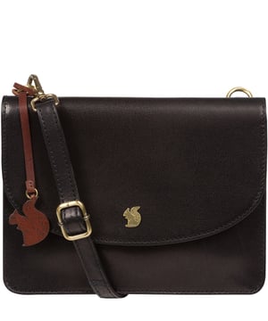 The 'Cara' cross body clutch bag from Conkca London is handcrafted from multi-toned leather for a beautiful finish. A magnetic press-stud secured cover opens to reveal the spacious interior that is lined with natural and untreated 100% cotton and includes two slip pockets. A full-width slip pouch on the rear of the bag is ideal for on-the-go storage. It comes with an adjustable leather strap with a maximum drop length of 70cm which is removable, converting the bag into a clutch bag. Adorned with the inimitable Conkca squirrel charm and metal logo.