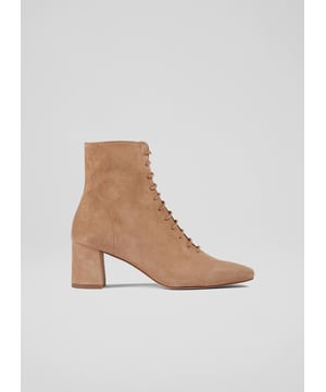 The perfect transitional style, our Arabella ankle boots work effortlessly throughout the seasons and have become a firm favourite with us, and you. Crafted in Spain from super-soft tan suede, they have a square toe, lace up to the front, have an inside zip and a wearable 60mm block heel. Wear them with dresses and skirts now and with trousers and knits later.