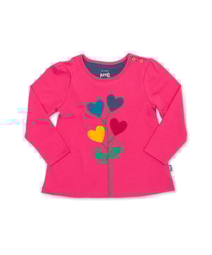 100% organic cotton | Proud to be certified by Control Union to the Global Organic Textile Standard (GOTS) | Flower and hearts appliqué | Rose pink | Single jersey | Tunic style | Coconut button shoulder opening | Long sleeved | Round neck | OEKO-TEX approved appliqué backing | Made in Turkey | Machine washable at 40 degrees, or at 30 degrees to be kinder to the planet