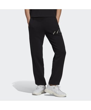 Nothing but pure ease — that's what these adidas track pants are about. With the perfect slouch, the relaxed shape hangs on the body with that certain "oh this?" look. It adds an edge even in its simplicity. adidas' cotton products support more sustainable cotton farming.  - Drawcord on elastic waist - 70% cotton, 30% recycled polyester French terry - Side pockets - Elastic cuffs - External hanger loop - Supports the Better Cotton Initiative  Shipped by adidas