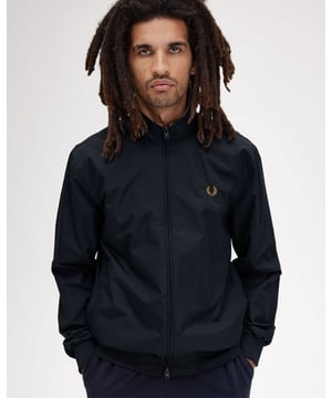 Based on traditional British outdoor gear, the Brentham jacket fuses sports styling with a smart aesthetic. Taking its name from Brentham Tennis Club in West London, where Fred first trained a century ago, the jacket is designed as protection against the elements. A simple design, using superior fabric, the hardwearing nylon twill is tough but lightweight. Perfect for the unpredictable outdoors.
100% PolyamideJ2660
 