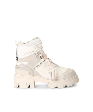 The KG Kurt Geiger Trekker Hiker boot features a bone upper with hook eyelets. There is a KG Kurt Geiger branded tab on the tongue, with a large black and white rubber branded patch at the back of the ankle. This product has undergone 167 checks to be registered with The Vegan Society.