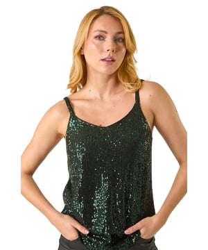 Embellished Sequin Cami Top from Roman. Dazzle your party guests with this sequined Dusk cami top! Cut from a soft jersey fabric that’s adorned in sequins, this piece features a feminine v-neckline and is designed in a party-ready sleeveless shape. This strappy silhouette is perfect under a blazer with leather trousers and sparkling accessories!