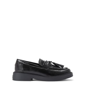 The KG Kurt Geiger Mack is a loafer featuring a black upper. There is a statement tassel detail on the toe.
