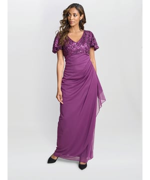 Sparkle and shine in this stunning dress! Flutter sleeves elevate this classic silhouette, giving you a modern silhouette, without being too fussy. This look is a must have.