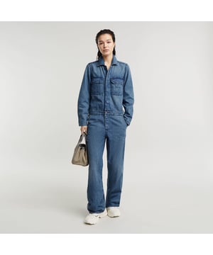 Shirt collar. Shank button at the neck and waist, combined with concealed snap buttons. Adjustable tabs at the cuff and back waist, snap buttons. Cargo pockets at chest, hidden snap buttons. Inset pockets, coin pocket. Snap closure. Low waist. Overall Painter is designed in a relaxed, loose fit. The tabs at the back allow for more shape around the waist. 100% Cotton (Regenerative). Rigid. Loose