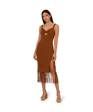 Trend-forward yet timeless, this fringe midi dress is a beautiful design. This cute dress features a sweetheart neckline, empire waist, tank straps, and a fringe midi skirt. Designed with a ribbed knit fabric, this fitted dress has a lot of stretch, making it a comfortable fit for most body types. With a slit at the side of the skirt and shirring at the bust - which has a bow appearance- this midi dress is a versatile look for casual and dressy events. A zipper closure at the centre back completes this sleeveless dress. Styled with neutral or metallic accessories, this fringe dress is a boho look.