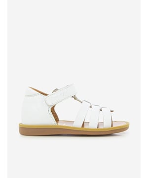 Introducing the Girls Leather Poppy Strap Sandals by Pom D Api in stunning white, perfect for your little girl's Holiday wardrobe. Check out its wonderful features: Chic Design: With an elegant poppy strap, these sandals infuse charm and style, making them a real show-stopper.Premium Quality: Crafted from exquisite genuine leather for unmatched comfort, these sandals are perfect for her delicate feet. Holiday Perfect: The crisp white colour makes these sandals versatile, pairing beautifully with any holiday ensemble.Redefine her wardrobe with these Girls Leather Poppy Strap Sandals in White from Pom D Api. Order now to gift her unparalleled comfort and style!