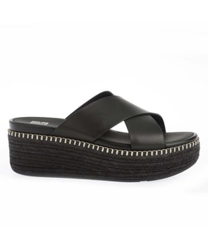Womens FitFlop Eloise Espadrille Leather Wedge Cross Slide Sandals in black.Elevate je look - in alle opzichten - met espadrille slides op FitFlop's comfortabele hoge sleehak zool.- Brede cross-over bandjes gemaakt van glad leer van hoge kwaliteit.- Slip-on constructie. - Comfortabele geheel lederen voering.- Hoge sleehak zool omwikkeld met natuurlijke jute voor een laidback-chique zomerse vibe.- Statement stiksels detail rond de bovenkant van de zool.- Microwobbleboard tussenzool - absorbeert schokken verspreidt druk en biedt buitengewoon comfort.- FitFlop merk op het voetbed.- Slip-resistant rubberen zool.- Gemiddelde tot wijde pasvorm.- Wig hoogte 2.8 "- 7.1cm ongeveer.- Leer en textiel bovenleer Lederen voering Synthetische zool.- Ref: HS6-001De afmetingen zijn bedoeld als richtlijn.
