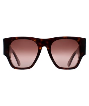Las gafas de sol Chloe Square Womens Dark Havana Brown Gradient CH0233S son una mezcla de sofisticación y encanto moderno. Estas monturas cuadradas de gran tamaño ofrecen confianza y cobertura, y están meticulosamente diseñadas para complementar cualquier forma de rostro. El icónico logotipo de Chloe delicadamente grabado en la patilla es sinónimo de su refinada artesanía.