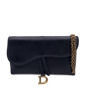 VINTAGE, RRP AS NEW
Gorgeous CHRISTIAN DIOR Saddle WOC Wallet on chain, made of Black shiny leather. Saddle flap is embellished with the classic D-shaped stirrup detail in gold metal. It wiil come with a removable chain shoulder strap. It can be carried by hand, over the shoulder or across the body. Black leather interior. 6 card slots, 3 patch pockets, and 1 removable zippered pouch inside. 'Christian Dior Paris - Made in Italy' embossed inside. Serial number engraved on leather inside. Condition Rating: A - EXCELLENTCondition Details: In excellent condition. Christian Dior dustbag included. Please see the photos and/or ask if you need further information or if you have any doubtsMeasurements (cm): Height: 11.4Length: 17.8Box?: No Measurments:  length: 178 mm height: 114 mm