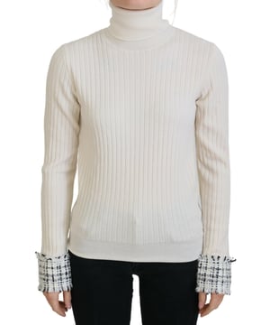 Marca: Dolce & Gabbana  
Estilo: Suéter de punto informal  
Color: Marfil  
Detalles: Mangas largas, cuello alto, puños desgastados  
Hecho en Italia  
Material: 76% lana virgen, 10% alpaca, 10% lana, 5% nailon