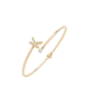 Design:This simple but beautifully styled initial bangle bracelet is perfect for those who covet delicate jewellery with a hint of sparkle, offering a sophisticated finishing touch to any outfit.Pretty and petite, this initial open cuff bangle features a hinge on the underside which makes it easy to put on and take off. The opening is designed to be on top of the wrist, where a zircon adorned monogram sits on one side and a single larger cubic zirconia resides on the other.What can be more personal than a name? Give this initial bangle bracelet as the perfect personalised birthday gift. Materials:Handcrafted using 925 sterling silver, dipped in 22ct gold. White cubic zirconia.Style Notes:Perfect pairing to the initial ring.Personalised birthday gift ideas. Bridesmaid gifts. Simple everyday styling.Dimensions:Bracelet: 19.5cm Packaging:This item is presented in a Latelita London signature jewellery box.Care Instructions:To maintain your jewellery, wipe gently with a damp cloth that is soft and clean. Do not soak in water. Avoid contact with soaps, detergents, perfume or hair spray.