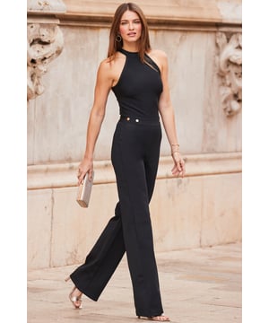 REASONS TO BUY:

A one-piece with wow factor
That silhouette is just stunning
Sexy halter neck
Nipped-in waist adorned with luxe gold buttons
On-trend flared legs
Add a pop of colour with a bright bag

Inside leg to fit: Short 29" | Regular 31" | Long 33"