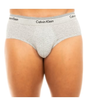 Calvin Klein slip. 
 Gray. 
 Elastic rubber waistband, with the name of the signature embroidered, consecutively. 
 Comfortable and breathable fabric. 
 Anatomical front, with the ability to hold without tightening. 
 Seams seen in tone. 

 Composition: 95% Cotton - 5% Elastan 

 Washing instructions: 
 -Wash at max. 40 ° C 
 -Do not use bleach. 
 -Supports dry cleaning. 
 -Allows to use dryer. 
 - Iron at max. 130 ° C