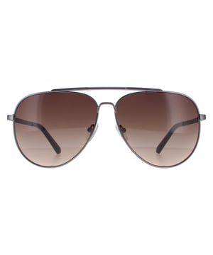Guess Aviator Mens Matte Gunmetal Brown Gradient  GU00059  Sunglasses are a aviator design that effortlessly blends modern trends with a touch of classic elegance. The frame is crafted from high-quality metal , ensuring durability and long-lasting performance. The Guess logo features on the temples for brand authenticity.