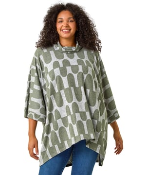 Curve Geometric Print Roll Neck Top from Roman. Add a touch of bold style to your Autumn Winter wardrobe with our Curve geo printed top. Featuring an all-over abstract geo print, this top is designed with 3/4 length sleeves, cosy roll neckline, and is crafted from a soft snit fabric for maximum comfort and warmth. Finishing below-hip length for a flattering fit that pairs perfectly with jeans and ankle boots for a trendy fall look.