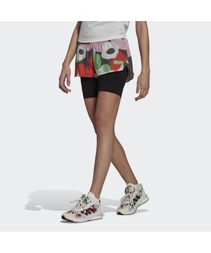 Brighten up streets and sidewalks in these adidas running shorts, a collaboration with the Marimekko design studio. They have a bold flower print that celebrates women's empowerment and self-expression. The two-in-one shorts combine stretchy inner short tights with an outer shell for coverage you won't have to think about. AEROREADY manages your body's moisture to keep you dry and moving toward the finish.Made with a series of recycled materials, and at least 60% recycled content, this product represents just one of adidas' solutions to help end plastic waste.  - This model is 179 cm and wears a size S. Their chest measures 80 cm and the waist 65 cm. - Regular fit - Drawcord on elastic waist - Shell: 88% recycled polyester, 12% elastane ripstop - Inner tights: 72% recycled polyester, 28% elastane interlock - Moisture-absorbing AEROREADY - Reflective details - Marimekko graphic  Shipped by adidas